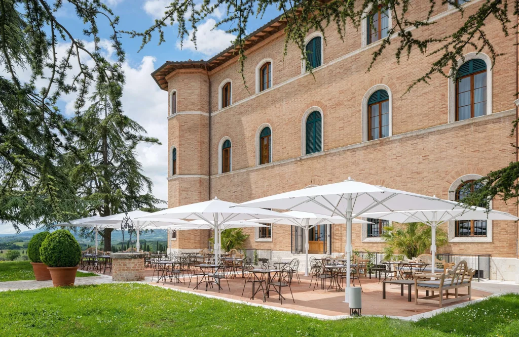 Exterior of Precise Tale Poggio Alla Sala showcasing its elegant historic villa and timeless Tuscan architecture.