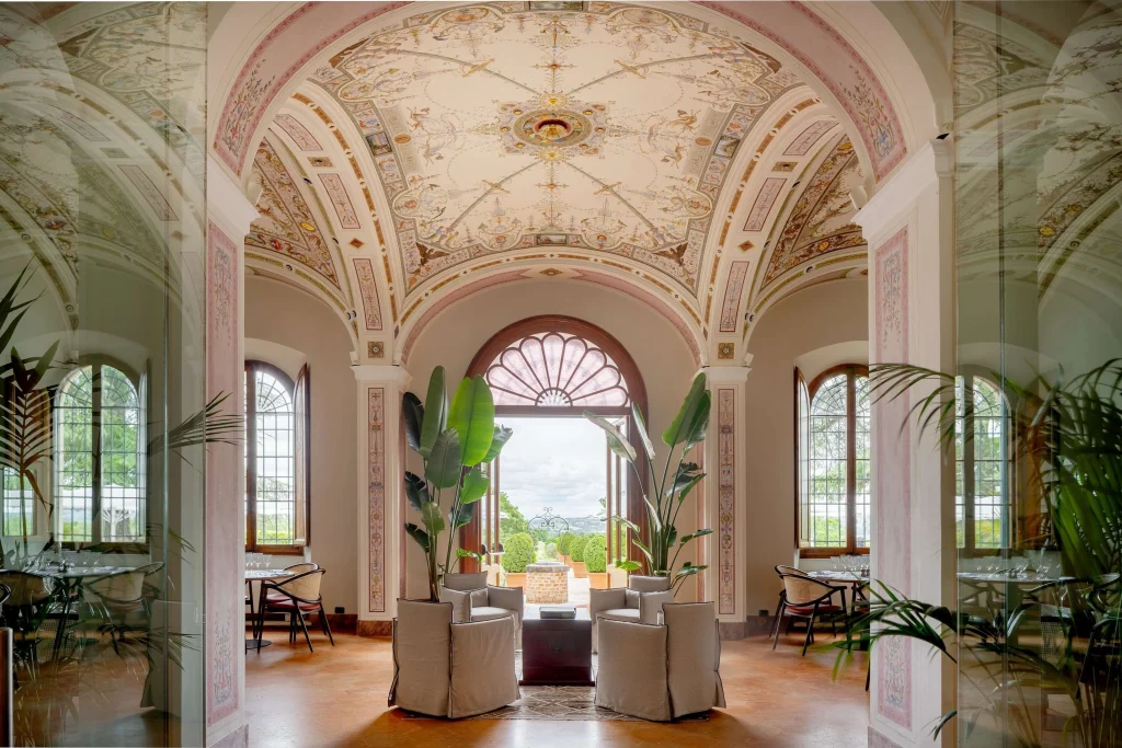 Historic interior at Precise Tale Poggio Alla Sala featuring ornate frescoed ceilings, elegant heritage details, and refined Italian craftsmanship.