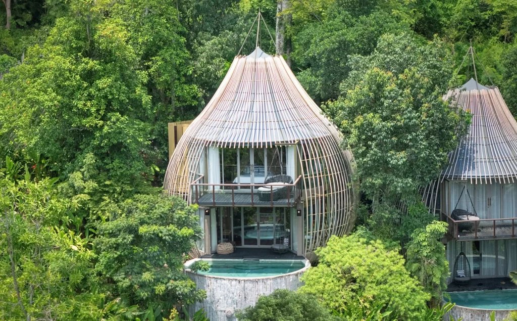 Private infinity pool surrounded by forest canopy at Keemala resort Phuket