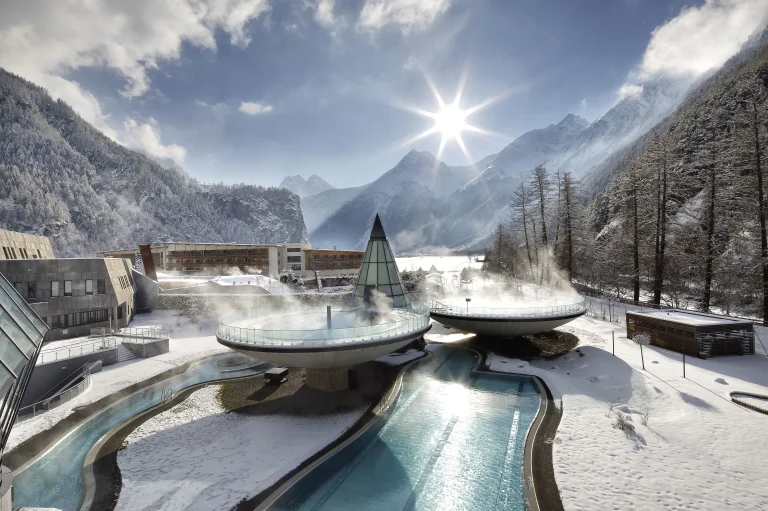 Aqua Dome hotel exterior at dusk in Längenfeld, Ötztal valley, Austria