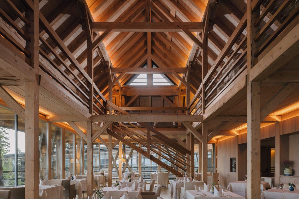 Restaurant 1500 at Vigilius Mountain Resort, timber and glass dining room with panoramic Dolomite views in South Tyrol