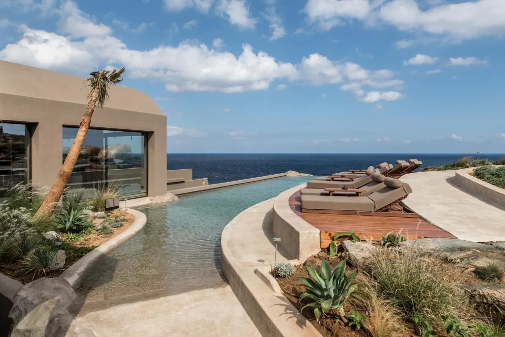Acro Suites exterior architecture built into the rocky cliffside, Crete Greece