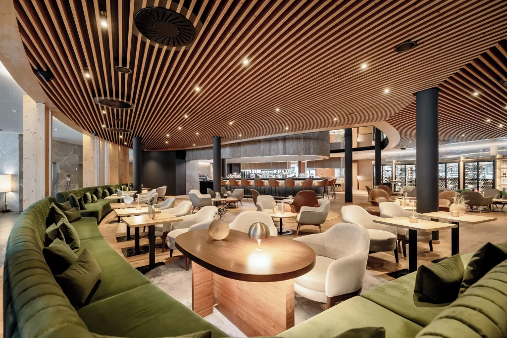 Restaurant interior at Aqua Dome Längenfeld with alpine views through large windows