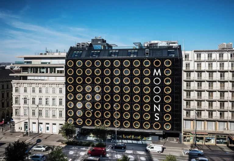 MOOONS Vienna black facade with circular windows, Wieden district