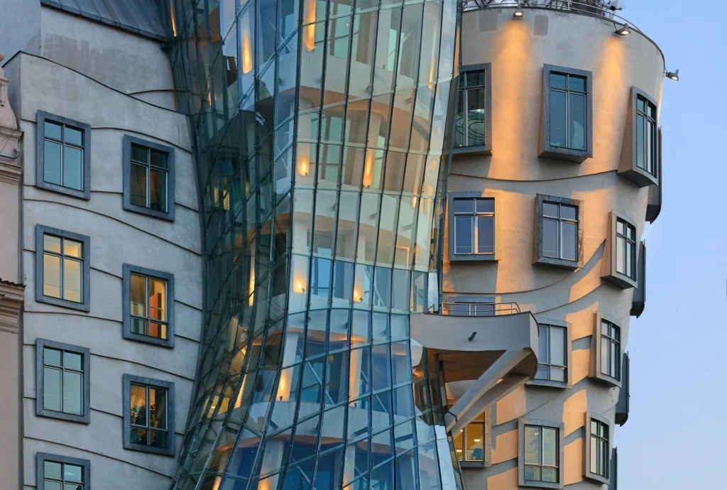 Dancing House Prague glass tower close-up — curved Ginger tower facade with steel and glass designed by Frank Gehry