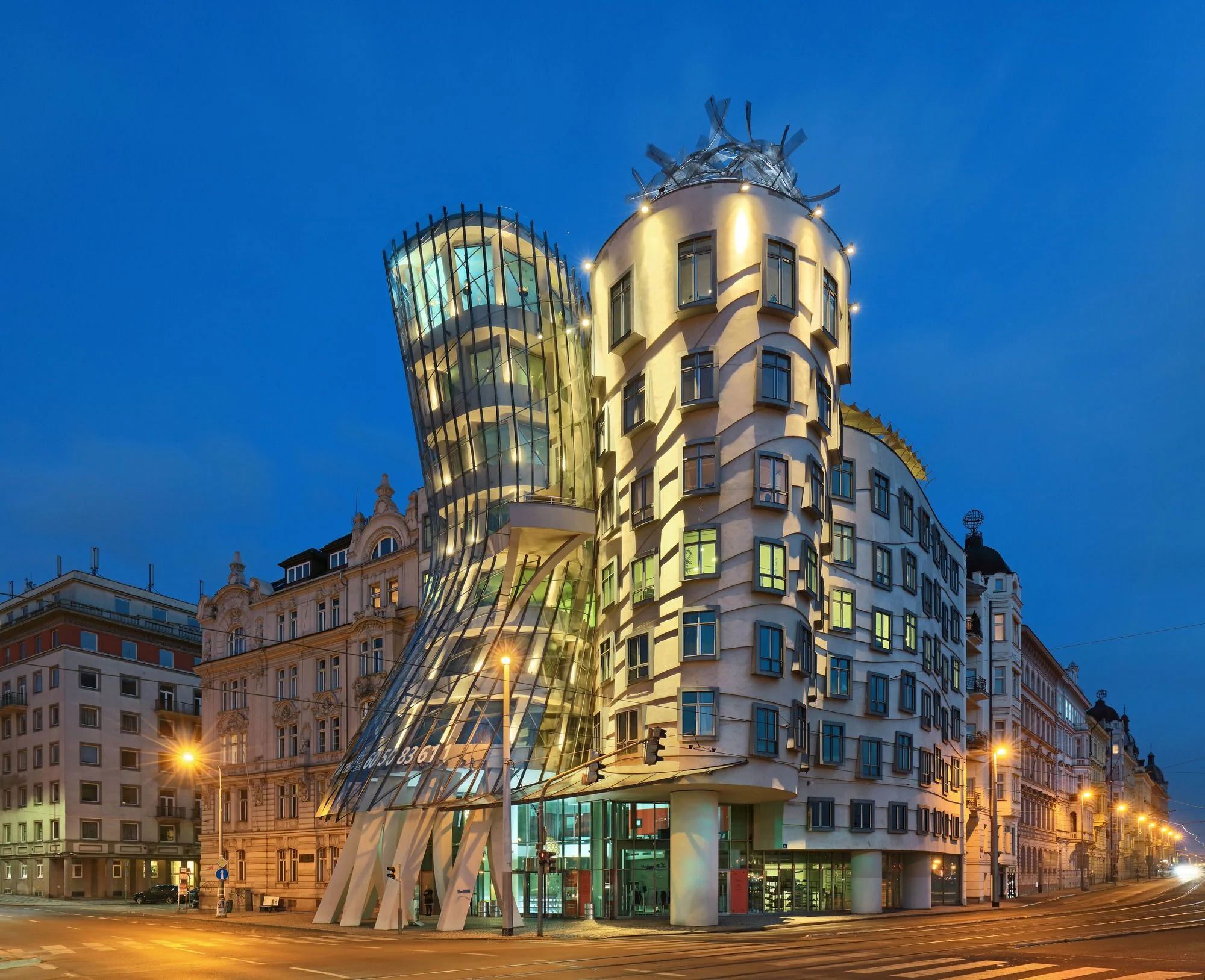 Dancing House Hotel Prague exterior — deconstructivist glass and stone towers by Vlado Milunić and Frank Gehry on the Vltava riverfront