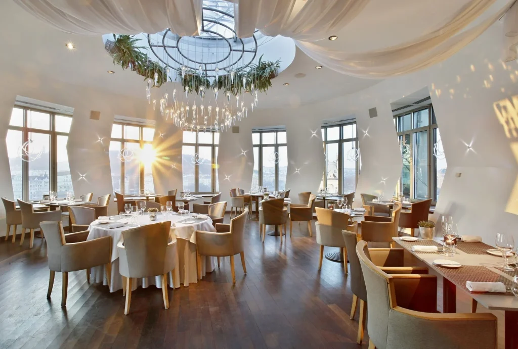 Ginger and Fred restaurant Prague rooftop terrace at Dancing House Hotel — panoramic views of Prague Castle and Vltava River from the 7th floor