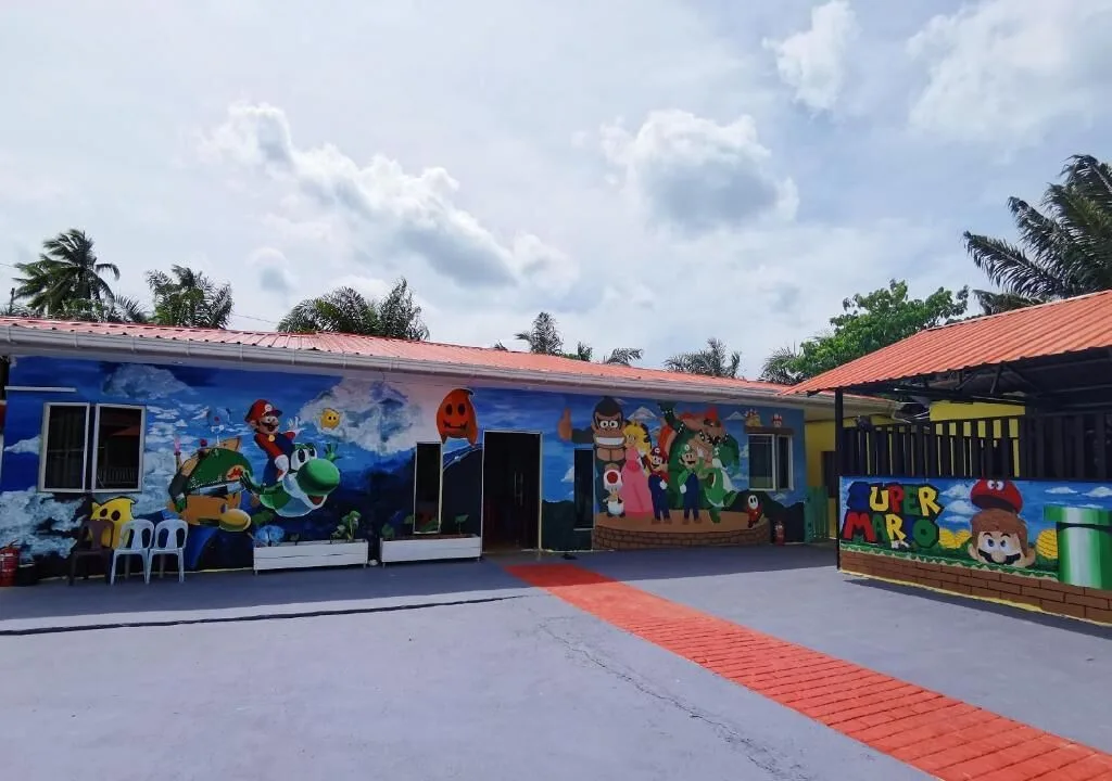 Mario and Luigi mural on the exterior wall of Mushrooms Inn, Semporna, Malaysia