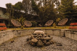 Relaxed outdoor social area surrounded by greenery