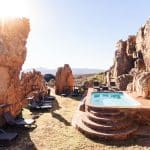 Outdoor pool surrounded by sandstone rocks at Kagga Kamma Eco Lodge