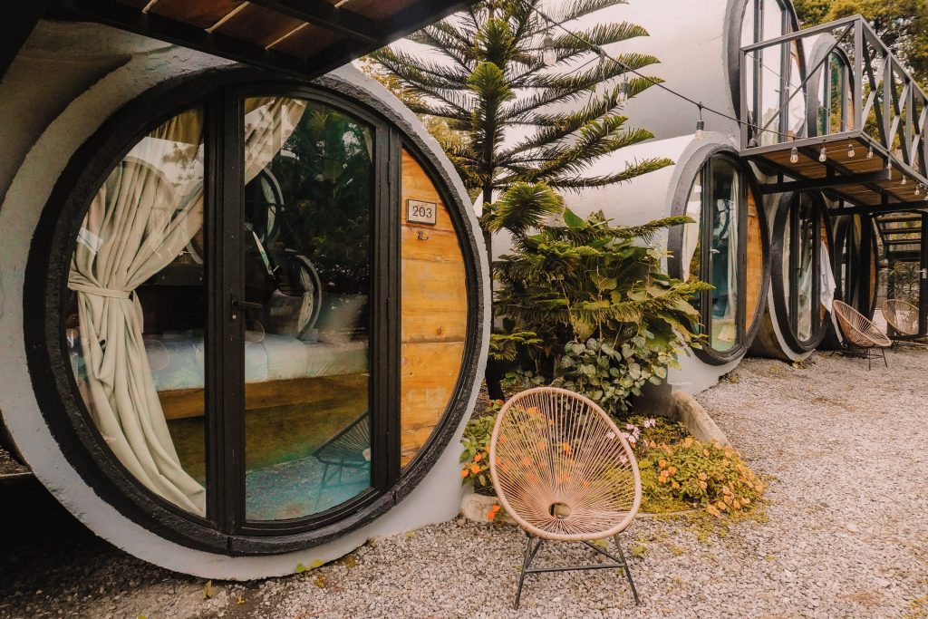 Concrete cylinder guest rooms with circular entrances at ONDA Boquete