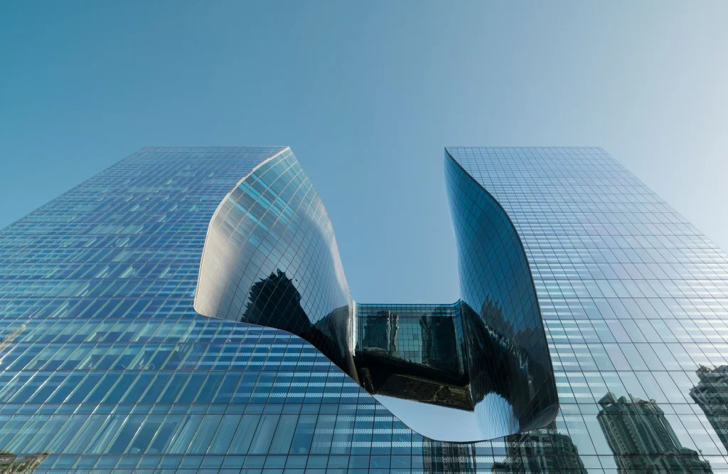 Curved glass façade inside the central void of The Opus Dubai